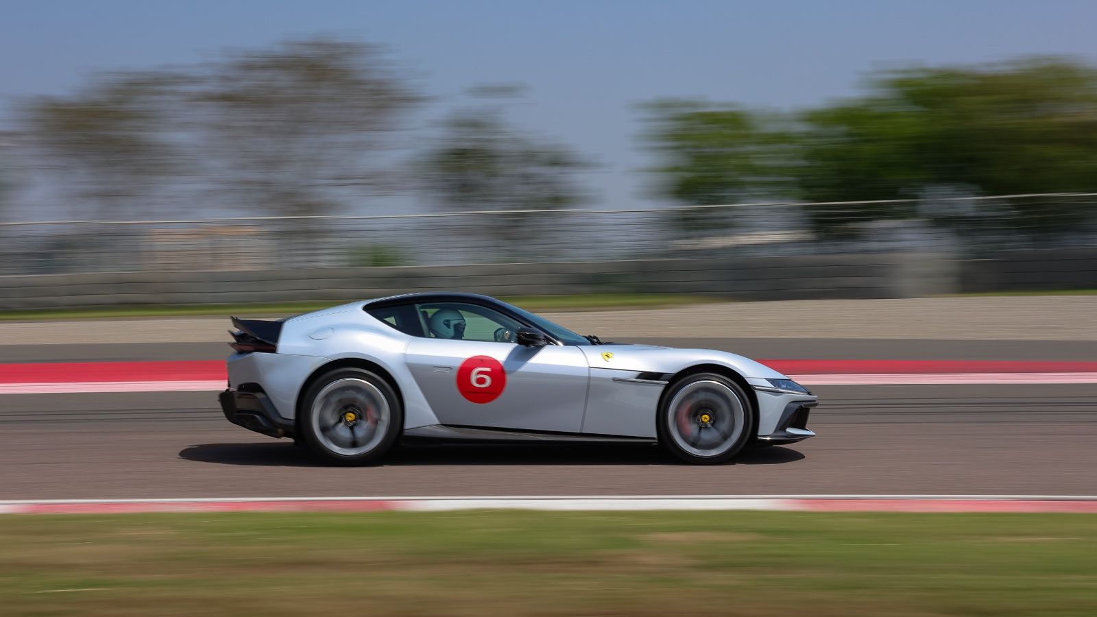 Ferrari 12 cilindri profile tracking shot BIC